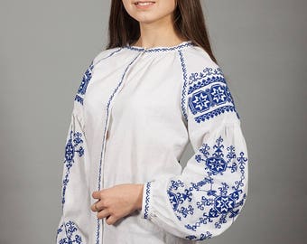 Women white vyshyvanka. Traditional Ukrainian women's blouse. Ethnic sorochka shirt. Ukrainian clothes. Embroidered blouse cross-stitch