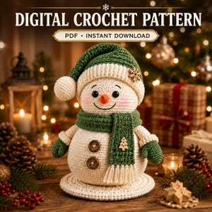 May include: A crochet snowman doll featuring a green hat with a pom-pom, a matching green scarf with fringe, and two brown buttons on its body. The text reads DIGITAL CROCHET PATTERN and PDF INSTANT DOWNLOAD. It has a small wooden snowflake and tree accent.