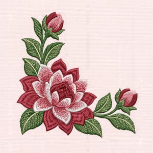 May include: An embroidery design featuring a large central flower with deep red and white petals, flanked by two smaller flower buds and several textured green leaves. The floral arrangement is positioned in a corner layout on a light pink fabric.
