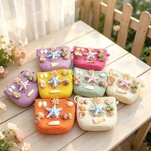 May include: A collection of eight small woven handbags in various colours including lavender, pink, yellow, mint green, cream, and orange. Each bag is decorated with a central starfish, assorted seashells, and small beads on the front surface.