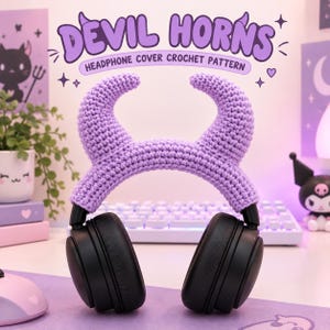 May include: A pair of black over-ear headphones featuring a light purple crocheted cover shaped like devil horns. The text above the headphones reads DEVIL HORNS HEADPHONE COVER CROCHET PATTERN in a purple font against a light background.