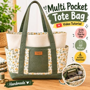 Può includere: Una borsa tote a più tasche con una sezione superiore color crema e una inferiore con un motivo floreale giallo su sfondo crema. Presenta bordi, manici e una tasca centrale verde oliva con un'etichetta marrone con la scritta Handmade.