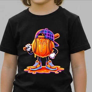 May include: A black t-shirt featuring a graphic of a cartoon baseball character wearing a plaid cap and high-top trainers. The baseball has orange liquid dripping down its surface and is holding a wooden baseball bat over its shoulder.