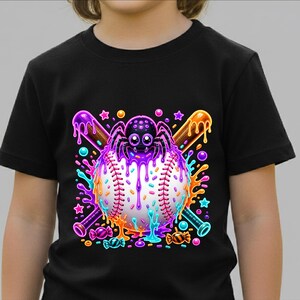 May include: A black short-sleeved t-shirt featuring a graphic print of a white baseball centred behind a purple spider. Two crossed baseball bats are positioned behind the ball, with colourful dripping paint, sprinkles, stars, and candy accents.