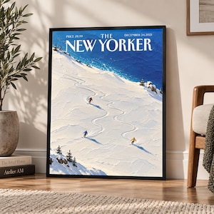 May include: A framed print of The New Yorker magazine cover dated December 24, 2021, featuring an oil painting style illustration of three skiers on a snowy mountain slope with a deep blue sky and ocean in the background.