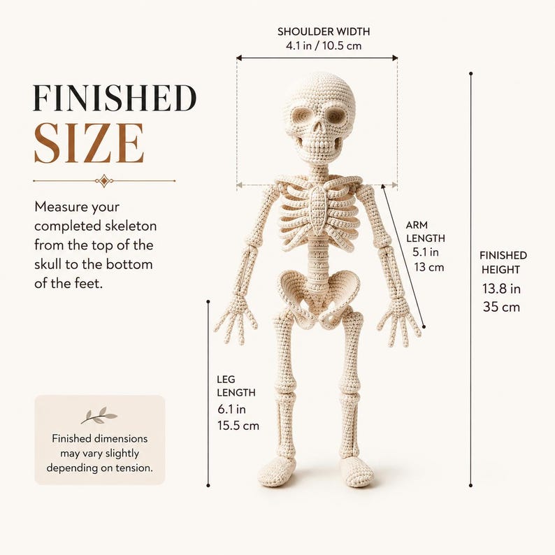 This full-body crochet skeleton ornament or decoration is presented vertically with both arms relaxed beside the torso and long legs extending to rounded crocheted feet. The cream-colored yarn creates a soft textile interpretation of a human skeleton, including skull, ribs, spine, pelvis, finger bones, knee joints, and foot shapes. The clean studio view makes the entire crochet construction easy to see.