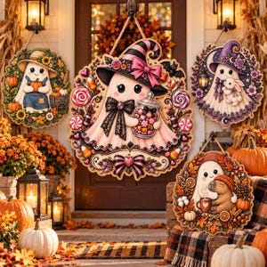 May include: Four circular wooden wall hangings featuring cartoon ghosts. One ghost wears a straw hat, one wears a pink witch hat holding a candy jar, one wears a purple hat with a bunny, and one sits with a capybara amidst autumn leaves.