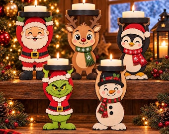 May include: Five wooden candle holders featuring cutout figures of Santa Claus, a reindeer, a penguin, a green creature, and a snowman. Each figure holds a black circular platform supporting a white tea light candle. Text at the bottom reads SVG AI EPS DXF PDF.