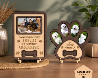 May include: Two wooden pet memorial frames with dark brown borders and light wood centers. The rectangular frame features a photo of a dog and the text YOU WERE MY FAVORITE HELLO AND MY HARDEST GOODBYE. The paw-shaped frame displays three dog photos.