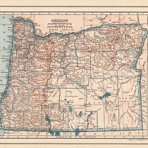 May include: A vintage-style map of Oregon printed on aged paper, featuring black text, blue water borders, and tan land shading. The map includes a grid, a scale in miles, and a detailed gazetteer listing counties and cities on the left side.