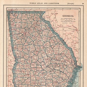 May include: A vintage map of Georgia, featuring county lines and city names. The map is in shades of red, blue, and beige, with the title "Georgia" prominently displayed. The map includes a scale of miles and a list of counties and towns.