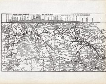 May include: A black and white vintage map of the Great Northern Railway, featuring a detailed rail network across the United States, an elevation profile at the top, and the circular Great Northern Railway logo printed on the left side.