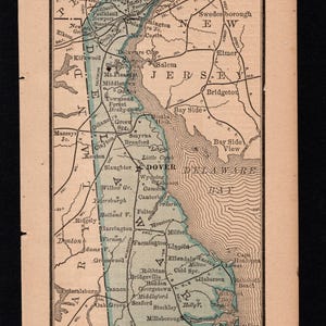 May include: A vintage map of Delaware, featuring towns like Dover and Wilmington, with a scale in miles. The map is from an atlas, with the title "Atlas of the World" at the top.