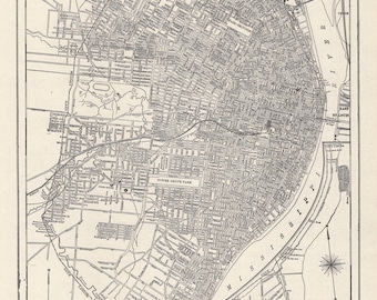 May include: A black and white vintage map titled Map of the City of St. Louis, Missouri, from a World Atlas and Gazetteer. The detailed street grid shows the Mississippi River, city limits, parks, and cemeteries with a scale of feet included.