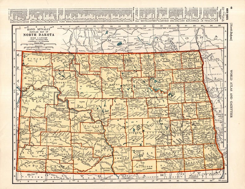 May include: A vintage map of North Dakota, featuring a detailed depiction of the state's counties and geographical features. The map, from Rand McNally, is in shades of beige and brown, with red borders and text. The title "North Dakota" is prominently displayed.