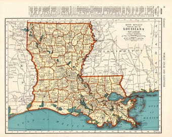 May include: A vintage Rand McNally map of Louisiana featuring tan landmasses with orange borders, black text for parish names and cities, and a blue Gulf of Mexico. The map includes a scale, grid lines, and a gazetteer index at the top and sides.