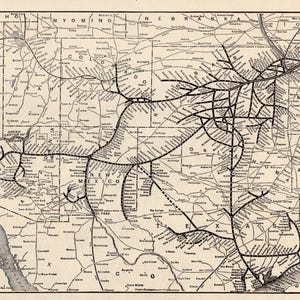 May include: A black and white historical map titled World Atlas and Gazetteer, featuring the Atchison, Topeka and Santa Fe Railroad System and Connections. The map displays state boundaries and rail lines across the central and western United States.