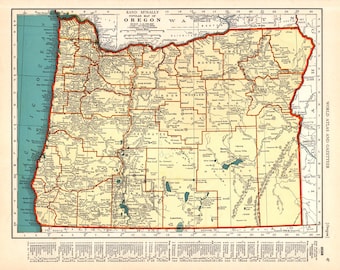 May include: A vintage map of Oregon, USA, with county borders outlined in red. The map shows major cities, rivers, and lakes. The map is titled "Rand McNally Popular Map of Oregon".