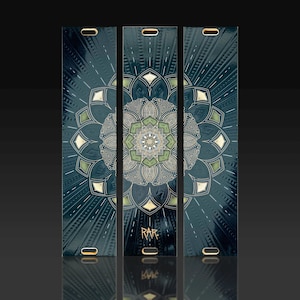 May include: Three vertical yoga mats with a dark teal background and a central mandala design in shades of green, gold, and silver. The mats have a glossy finish and the word "RARE" is printed on the bottom of the center mat.