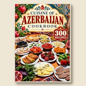 Op de afbeelding: Een kookboek getiteld Cuisine of Azerbaijan Cookbook met 300 Recipes, met een omslagillustratie van een houten tafel vol met diverse borden eten, waaronder gesneden vlees, kazen, verse groenten, fruit en granaatappels.