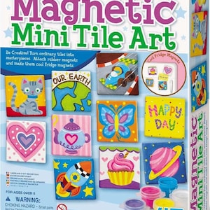 May include: A Magnetic Mini Tile Art craft kit box featuring colorful painted tiles with designs of a cat, Earth, race car, butterfly, heart, teapot, rocket, cupcake, and planet. Includes paint pots, a brush, and text labels in English.