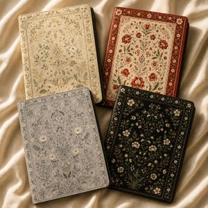 May include: Four rectangular notebooks with hard covers featuring intricate floral patterns. The covers are colored in cream, red, grey, and black, each decorated with detailed botanical illustrations of flowers, leaves, and vines in a symmetrical layout.