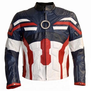 May include: A navy blue, white, and red leather jacket featuring a central silver ring at the collar, perforated panels, and an Avengers logo on the right shoulder. The left sleeve displays a small American flag patch and a black tag reading ROGERS.