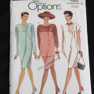 May include: A Vogue Easy Options sewing pattern envelope 7962 for sizes 14-16-18. The front displays illustrations of three dress variations: a light blue long-sleeve dress, a pink two-piece set with a hat, and a white short-sleeve dress with a handbag.