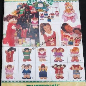 May include: A Butterick sewing pattern envelope for Cabbage Patch Kids dolls, numbered 3381. The front features illustrations of various doll outfits, including dresses, overalls, and holiday-themed clothing, with the brand name printed at the top.