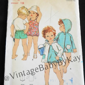 May include: Vintage Butterick pattern 5826 for toddlers. The illustration shows children in swimwear and outerwear. The pattern includes sizes 1/2, 1, 2, and 3. The pattern is marked with the text "Butterick" and "VintageBabyByKay".