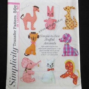 May include: Vintage Simplicity transfer pattern 5767 for simple-to-sew stuffed animals. The pattern includes instructions for eight toy pets, each approximately 9 inches tall. The animals include a camel, rabbit, kangaroo, lion, dog, elephant, cat, and horse.