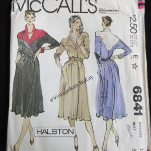 May include: Vintage McCall's sewing pattern envelope featuring three illustrated fashion designs. The envelope includes the text "HALSTON" and the pattern number 6841. The colors are primarily black, red, beige, and purple.