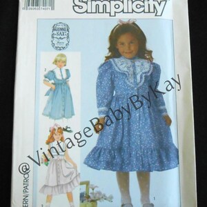May include: A Simplicity sewing pattern envelope, number 7407, size 4, featuring Gunne Sax designs. The cover displays illustrations of three dresses with long sleeves, lace collars, and ruffled hems in blue and white floral patterns.