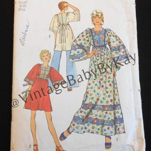 May include: A Simplicity sewing pattern envelope 5976 for a small size 8-10 miss. The front features illustrations of two garments: a short red dress with plaid accents and a long floral dress with wide sleeves, both with a square neckline.