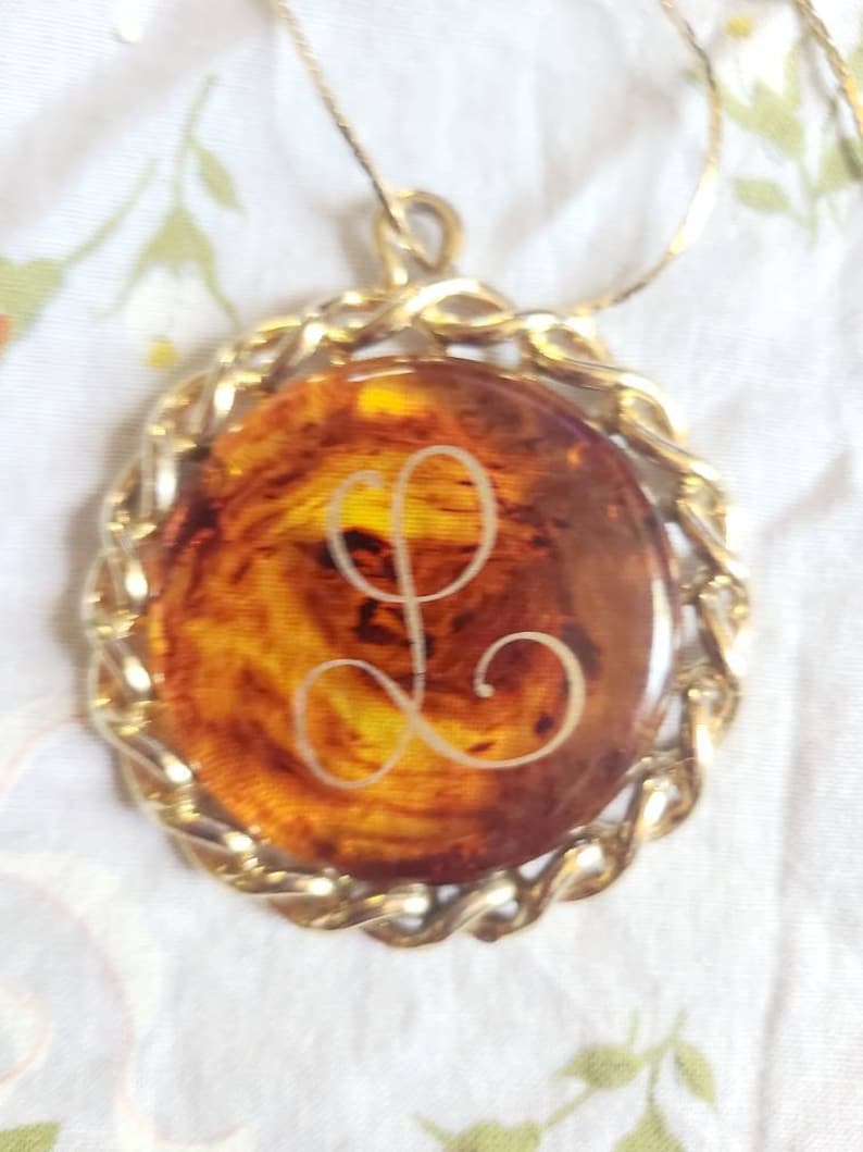 Vintage tortoise shell bakelite pendant with L monogram in a goldtone casing Free US shipping