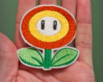 FIRE FLOWER—-Choose one Embroidered Iron-on Nintendo Throwback NES Mario Brothers. Indicate color in blue or orange.