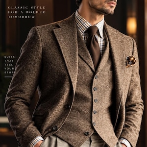 May include: A brown tweed three-piece suit featuring a blazer, a buttoned vest, and a plaid shirt with a solid brown tie. The text reads: RUBY ATTIRE, CLASSIC STYLE FOR A BOLDER TOMORROW, SUITS THAT TELL YOUR STORY, HERITAGE FIT MODERN YOU.