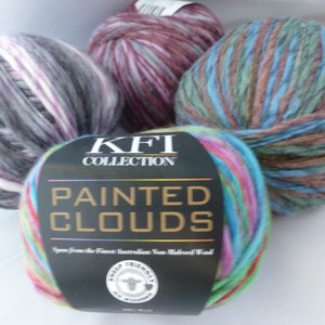 May include: Three balls of yarn in different color combinations. The yarn is labeled "KFI Collection Painted Clouds" and "Spun from the finest Australian Non-Mulesed Wool".