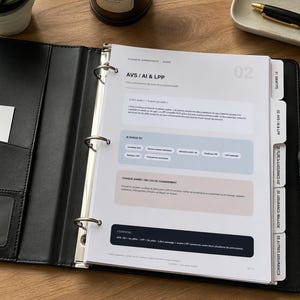 May include: A black leather three-ring binder containing white paper sheets with French text, including the heading AVS / AI & LPP. The binder features side index tabs labeled with numbers and categories, and a pocket on the inside front cover.