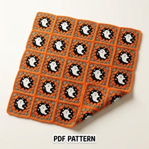 May include: A square crochet blanket composed of twenty-five individual granny squares. Each square features a white ghost on a black background, surrounded by a border of grey and orange yarn. The text PDF PATTERN is printed below the blanket.