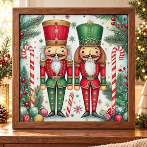 May include: A square framed diamond painting featuring two nutcracker figures in red and green uniforms, flanked by candy canes, pine branches, and colourful ornaments on a white background with a subtle grid pattern and gold snowflake accents.