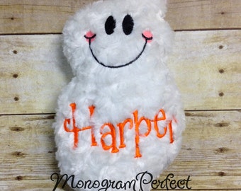 May include: White plush ghost with a smiling face and pink cheeks. The ghost has the name "Harper" embroidered on it in orange thread. The words "Monogram Perfect" are also embroidered on the ghost in black thread.