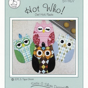 May include: Four owl-shaped hot pads in different colors and patterns. The hot pads are made of fabric and have embroidered eyes and beaks. The hot pads are arranged in a circle on a light brown surface. The text "Hot Who! Owl Hot Pads" is printed on the image.