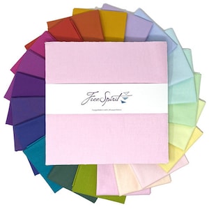 May include: A set of 20 fabric squares in a rainbow of colors, arranged in a circle. The squares are all the same size and are made of a soft, cotton fabric. The fabric squares are labeled "Free Spirit" and have a website address printed on them.