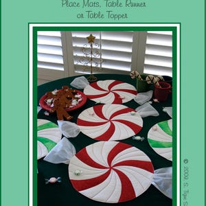 May include: Peppermint Twist table runner or place mats sewing pattern. The pattern features a red and white peppermint swirl design. The pattern is by Susie C Shore Designs.
