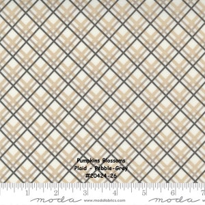 May include: A white fabric with a plaid pattern in shades of brown and gray. The fabric has a repeating pattern of diagonal lines. The fabric is labeled "Pumpkins Blossoms Plaid - Pebble-Grey #20424-26".