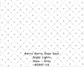 May include: White fabric with a repeating pattern of small gray stars and dots. The fabric has the text "Merry Merry Snow Days Night Lights Snow - Grey #2947-18" printed on it.