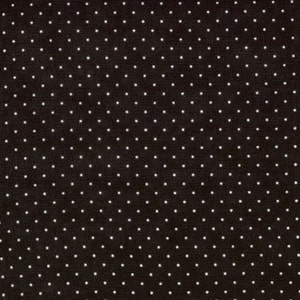 May include: Black fabric with a white polka dot pattern.