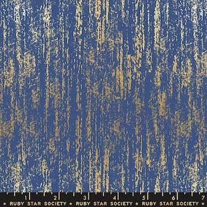 May include: Blue fabric with a gold metallic pattern. The pattern resembles a brushed or distressed metallic finish.