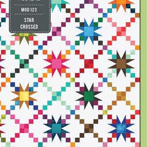 May include: A colorful quilt pattern featuring a repeating design of stars and squares in various colors like pink, blue, orange, and green. The quilt has a white background and the text "STAR CROSSED" is visible.